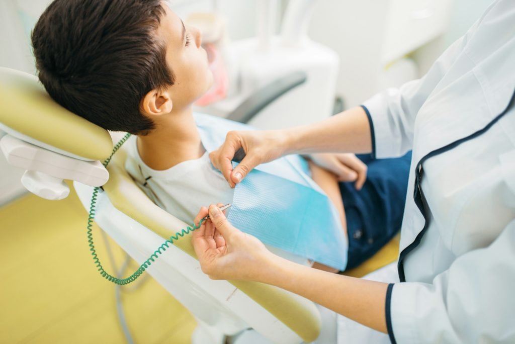 Boy in a dental chair, pediatric dentistry